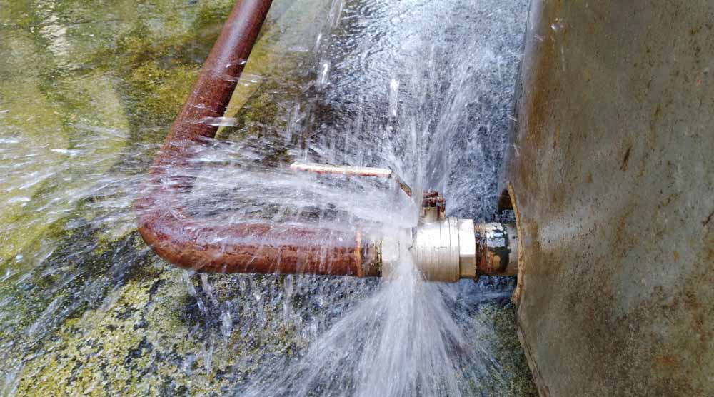 a broken pipe with flooding